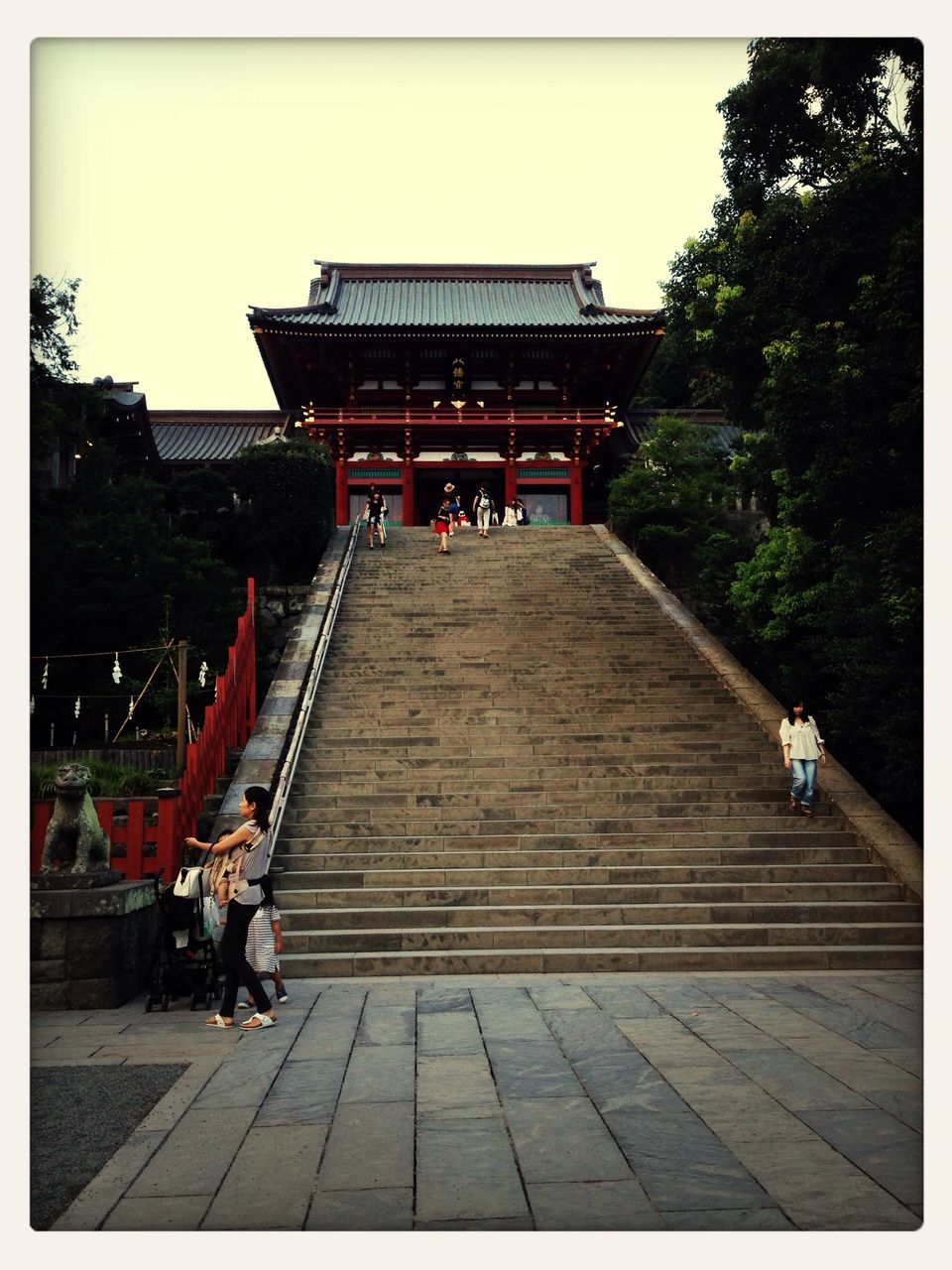 transfer print, auto post production filter, lifestyles, person, tree, leisure activity, steps, men, built structure, full length, architecture, clear sky, walking, sky, building exterior, the way forward, large group of people, steps and staircases, outdoors