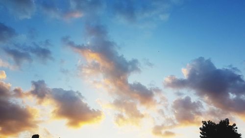 Low angle view of dramatic sky during sunset