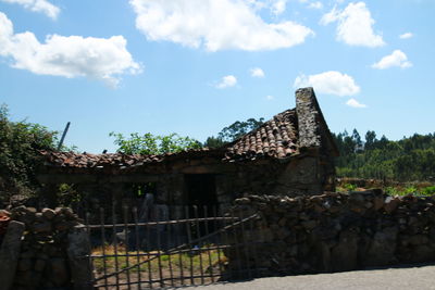 Old building against cloudy sky