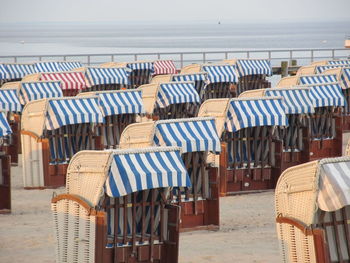 Row of chairs on beach