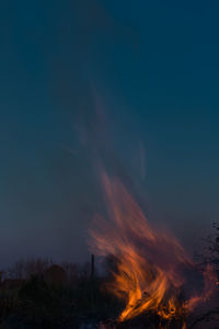 Scenic view of bonfire against sky at night