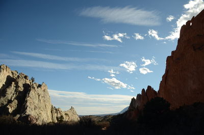 Low angle view of rock formations against sky