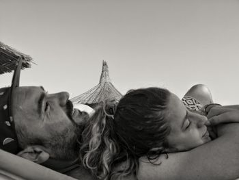 Portrait of friends against sky