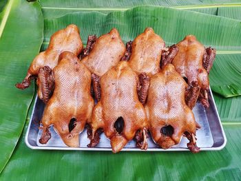 High angle view of meat on barbecue grill