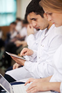 University students using technologies during conference