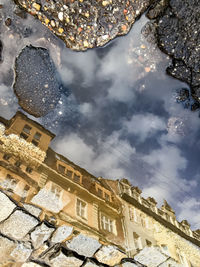 Low angle view of buildings in city against sky