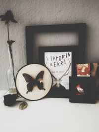 Close-up of heart shape on table against wall