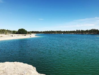 Scenic view of sea against blue sky