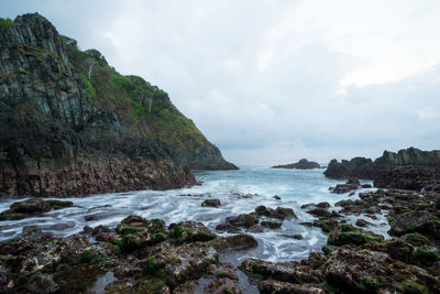 Scenic view of sea against cloudy sky