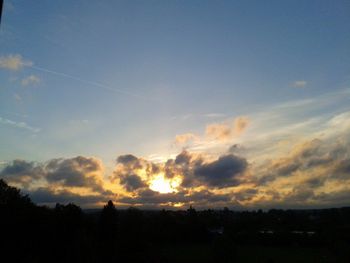 Silhouette of landscape against sky at sunset