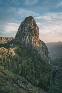 Rock formations on landscape against sky