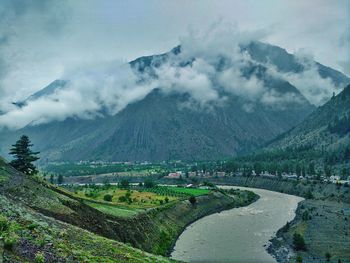 Scenic view of agricultural landscape against sky