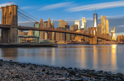 Bridge over river with buildings in background