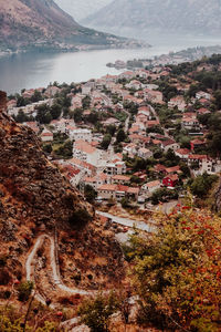 High angle view of townscape by sea