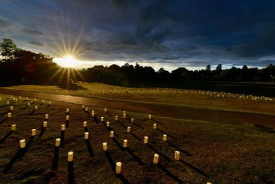 Scenic view of field against sky at sunset