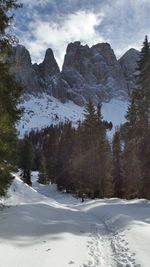 Scenic view of snow covered mountains against sky