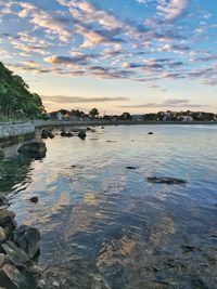 Scenic view of sea against sky at sunset