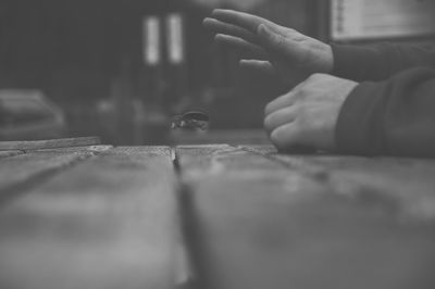 Close-up of hands holding table