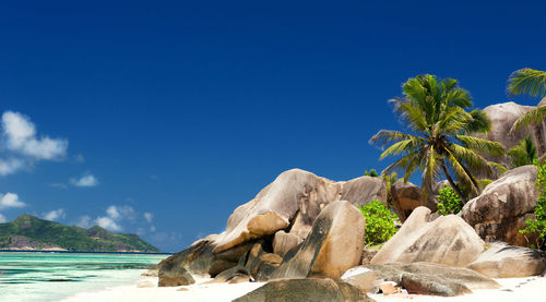 Low angle view of rock formations against blue sky