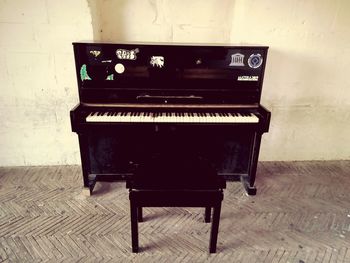 View of piano against wall at home