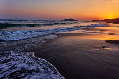 Scenic view of sea against sky during sunset