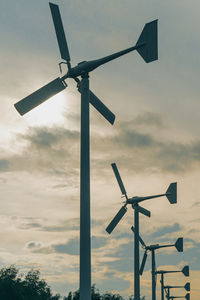 Low angle view of wind turbine against sky