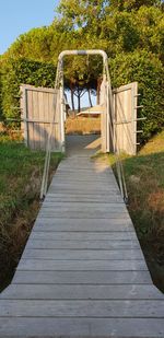 Wooden footbridge on footpath