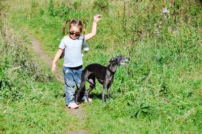 Full length of a girl standing on grass