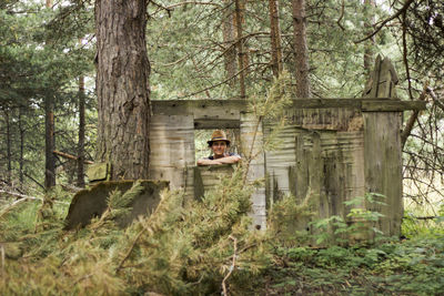 Woman in the tree house in forest