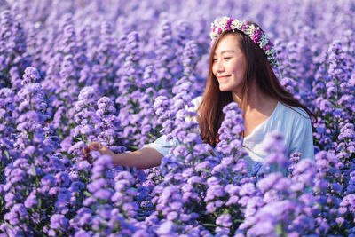 Beautiful young woman at field