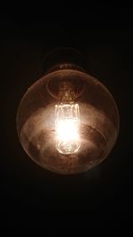 Low angle view of illuminated light bulb