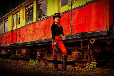 Portrait of man standing by train