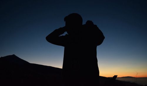 Low angle view of silhouette trees against sky at sunset