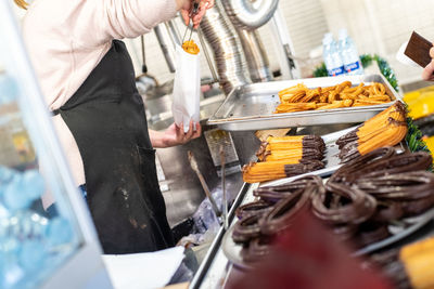 Midsection of man preparing food