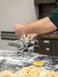 Midsection of man working on table