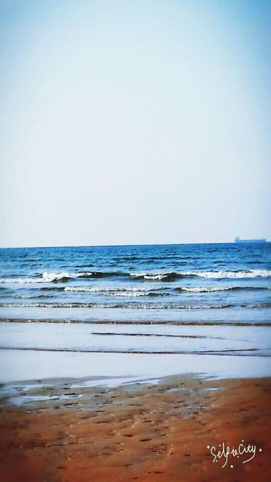 beach, sea, water, clear sky, sand, horizon over water, shore, copy space, tranquil scene, tranquility, scenics, beauty in nature, nature, wave, blue, idyllic, surf, coastline, no people, outdoors