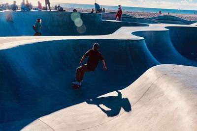 High angle view of man skateboarding on swimming pool