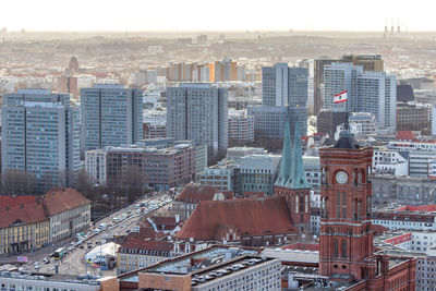 High angle view of modern buildings in city against sky