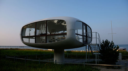 Built structure on field against clear sky