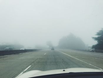 Road seen through car windshield