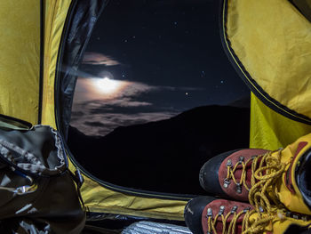 Low angle view of cropped car against sky