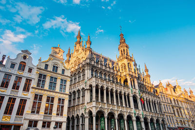 Low angle view of buildings against blue sky