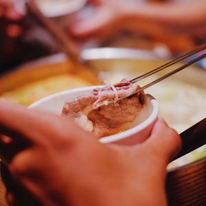 Close-up of hand holding ice cream