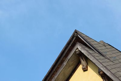 Low angle view of building against clear blue sky