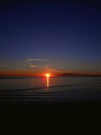 Scenic view of sea against clear sky during sunset