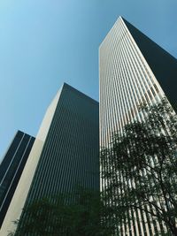 Low angle view of modern buildings against sky