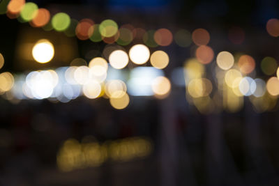 Defocused image of illuminated lights at night