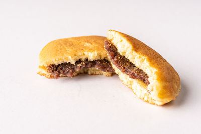 Close-up of bread on white background