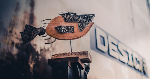 Close-up of sign on wall