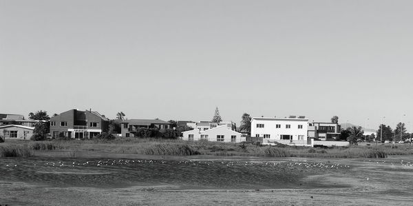 Buildings against clear sky